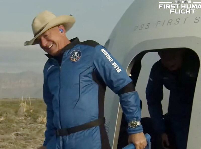 Back on Earth: Jeff Bezos climbs out of the New Shepard capsule after his space flight. Photograph: Blue Origin/AFP via Getty