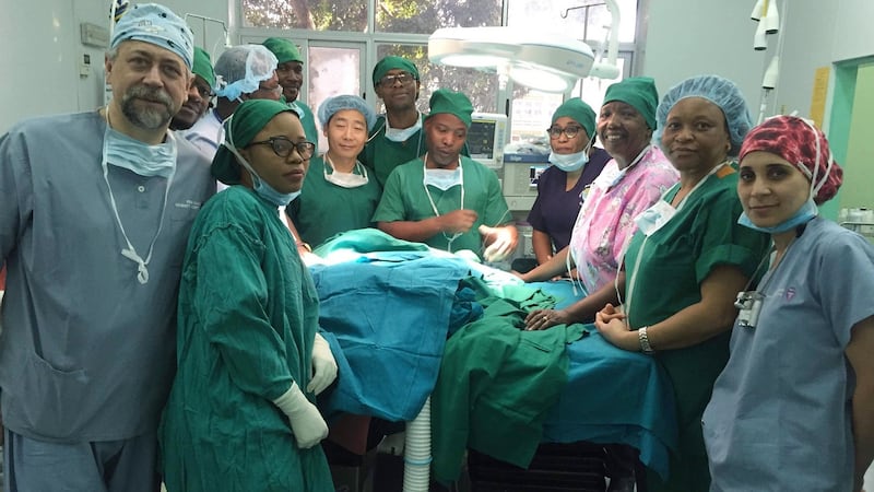 Prof Martin Corbally (left)  with Tanzania team members and members of Operation Childlife. Photograph: Eamon Tierney