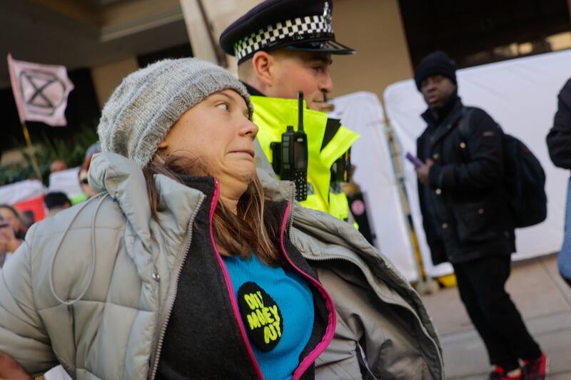 Greta Thunberg is arrested during a protest outside the venue of the Energy Intelligence Forum on October 17th, 2023. Photograph: Carlos Jasso/Bloomberg