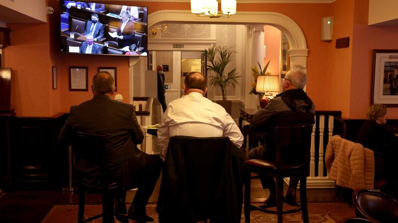 Watching Budget 2022 being announced on television in Buswells Hotel, Dublin. Photograph: Dara Mac Dónaill
