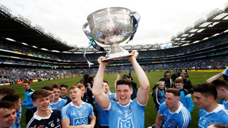 Diarmuid Connolly lifts Sam Maguire. Photograph: James Crombie/Inpho