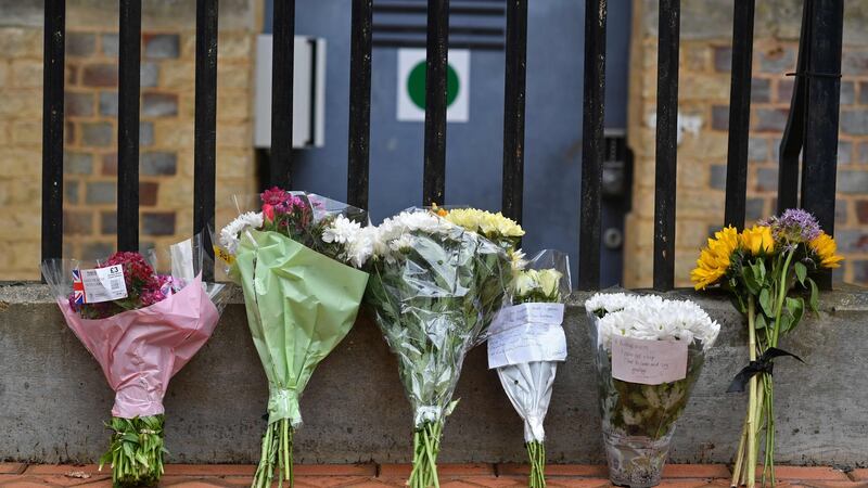Floral tributes  at a police cordon at the Abbey Gateway near Forbury Gardens park in Reading, west of London,  following a fatal stabbing incident the previous day. Photograph: Ben Stansall/AFP/Getty