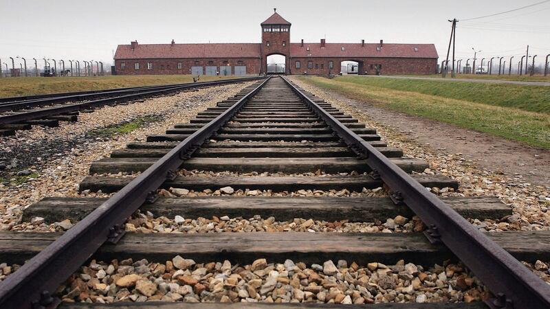 Railway tracks from the gates at Auschwitz II – Birkenau: “The gas canisters always came with the German Red Cross car and two SS men . . . who shook the gas into the openings,” wrote Marcel Nadjari. Photograph: Scott Barbour/Getty Images