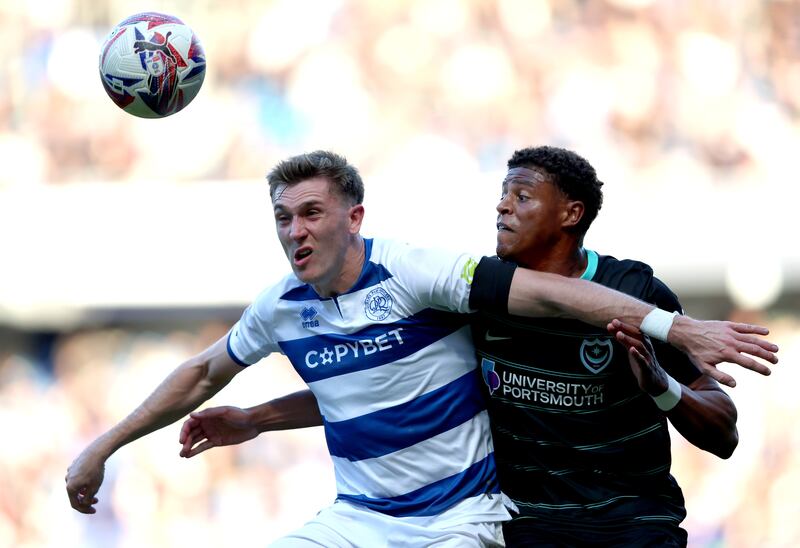 Jimmy Dunne of Queens Park Rangers and Kusini Yengi of Portsmouth FC. Photograph: Tom Dulat/Getty