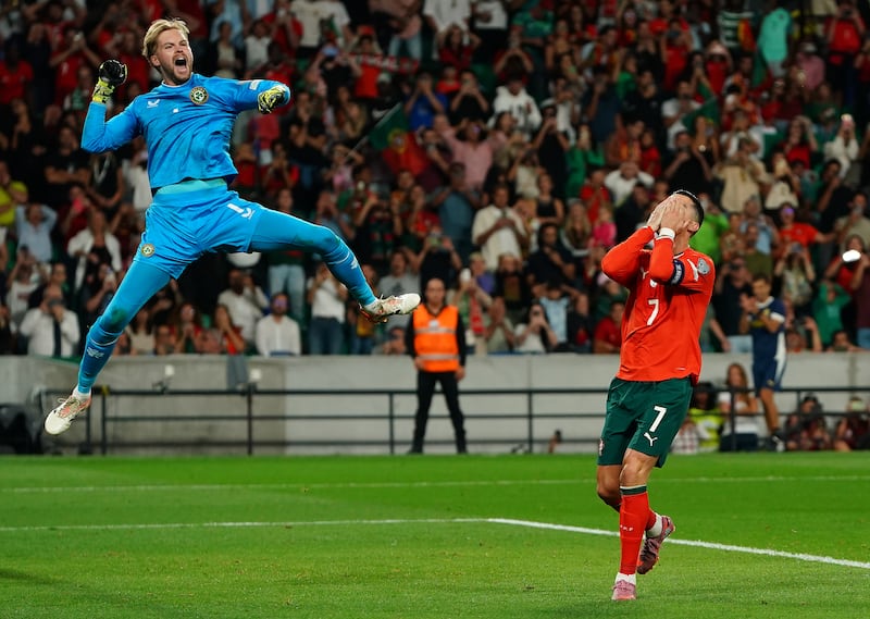 Ireland goalkeeper Caoimhín Kelleher celebrates saving a penalty kick from Portugal's Cristiano Ronaldo. Photograph: Gualter Fatia/Getty