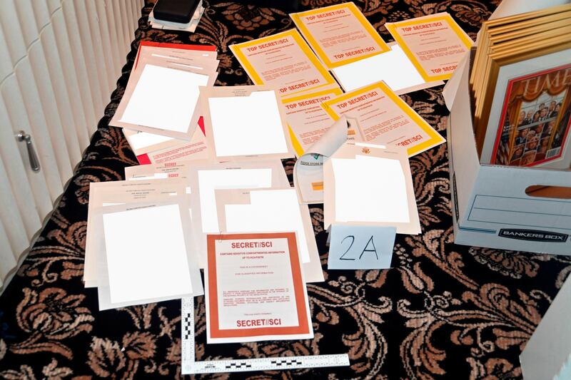 A photograph provided by the US justice department shows documents seized during a search by FBI agents of former president Donald Trump's Mar-a-Lago estate in Palm Beach, Florida in August 2022. Photograph:  The New York Times             