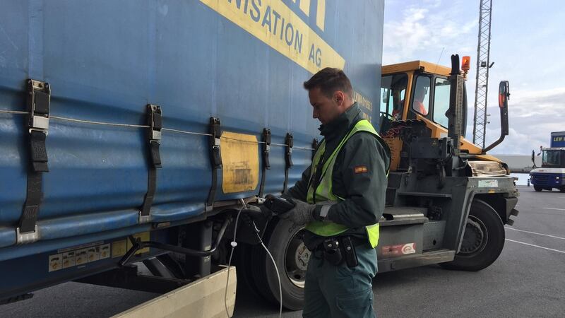 A civil guard checks a lorry boarding a ferry for the UK for stowaways. Photograph: Guy Hedgecoe