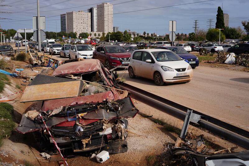 Wreckage of cars are spread on the sides of a road in Paiporta, Valencia in eastern Spain. Photograph: Manaure Quintero/AFP/Getty Images