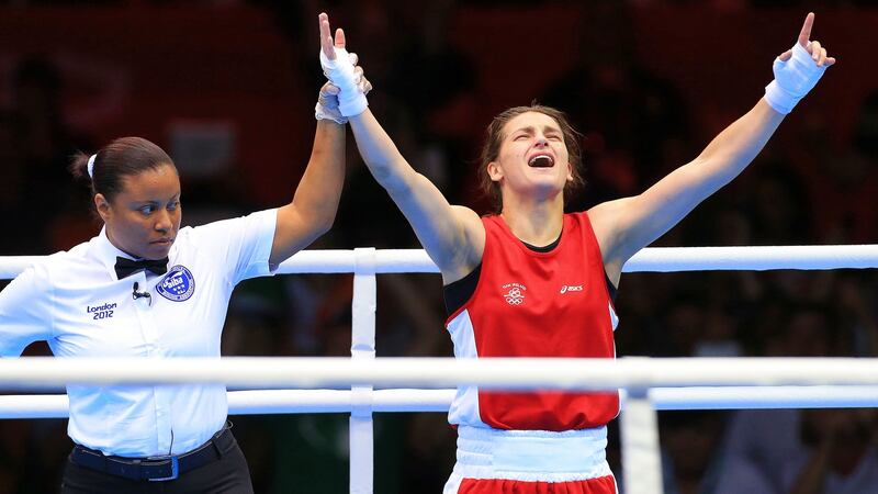 Katie Taylor celebrates as her hand is raised as the winner of the women’s lightweight gold medal at the ExCeL Arena during the 2012 London Olympics. Photograph: Dan Sheridan/Inpho