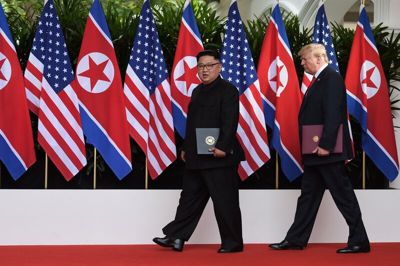 US president Donald Trump and North Korean leader Kim Jong-un after signing a landmark to deal to work toward complete denuclearisation of the Korean peninsula. Photograph: Anthony Wallace/Pool/The New York Times