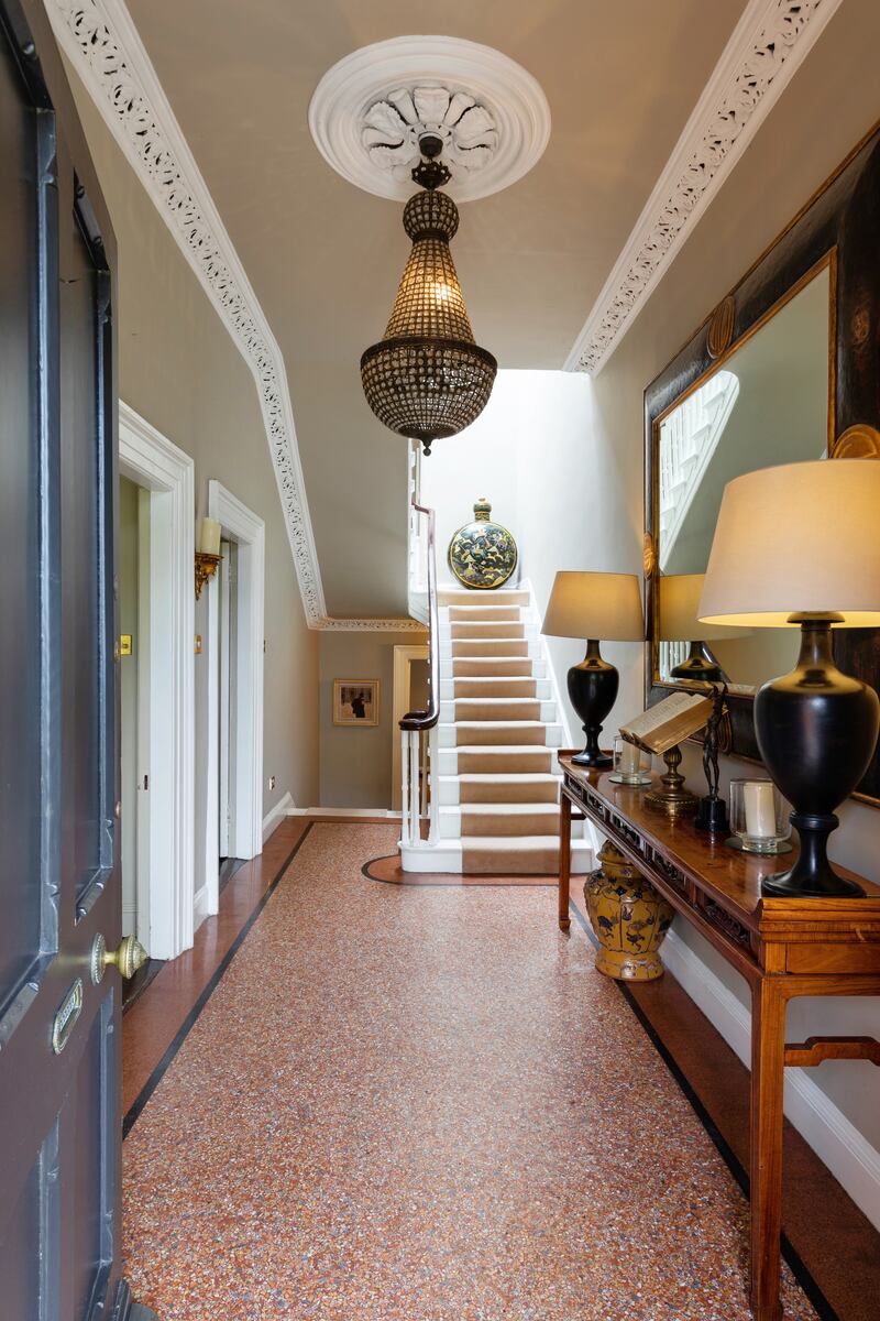 The hallway includes an abundance of period features.
