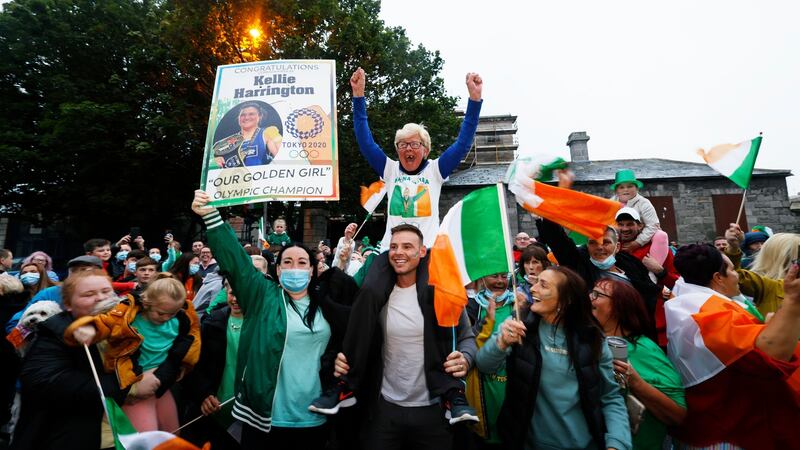 Neighbours and friends of Olympic Boxing Gold Medal Winner Kellie Harrington celebrate her Tokyo Olympic Gold medal win on Portland Row in Dublin. Photograph: Alan Betson
