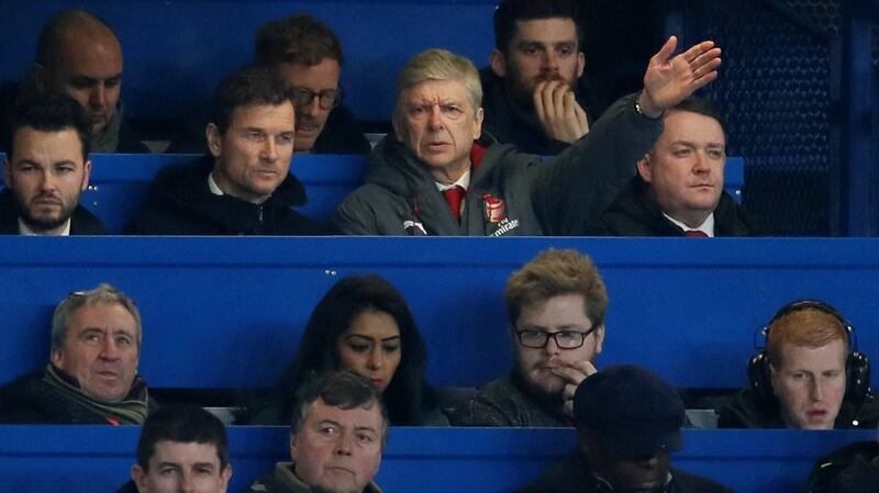 Arsenal manager Arsene Wenger reacts alongside first team coach Jens Lehmann in the press box. Photo: David Klein/Reuters