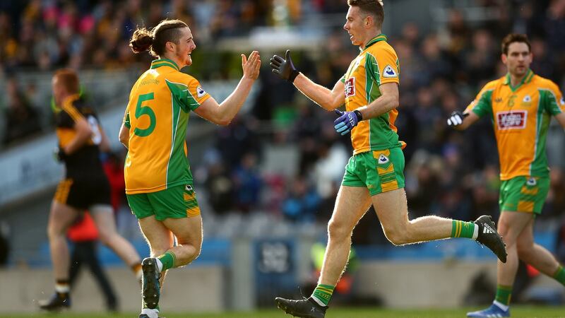 Corofin’s Jason Leonard celebrates scoring his side’s first goal with Kieran Molloy. Photograph: James Crombie/Inpho