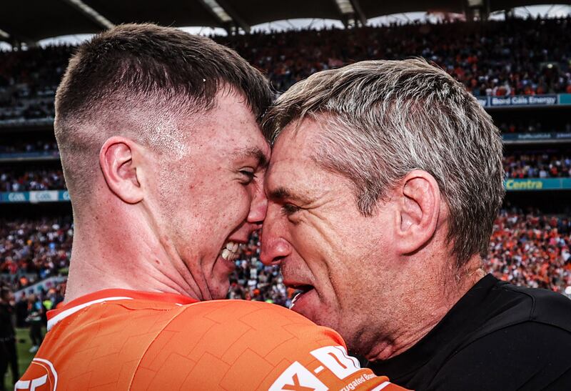 Armagh's Oisín Conaty and manager Kieran McGeeney celebrating after winning the All-Ireland final. Photograph: Tom Maher/Inpho