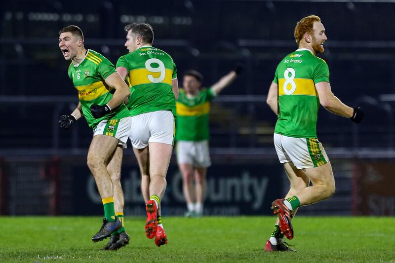 Glen’s Ciaran McFaul and Conor Glass celebrates Emmett Bradley’s (9) match winning score vs Naomh Conaill. Photograph: Lorcan Doherty/Inpho
