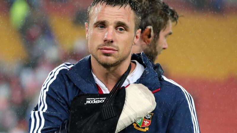 Tommy Bowe looks dejected after suffering a broken hand against the Queensland Reds. Photograph: Dan Sheridan/Inpho