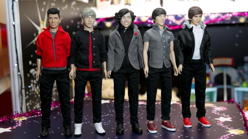 Plastic pop: One Direction figures. Photograph: John Phillips/UK Press via Getty