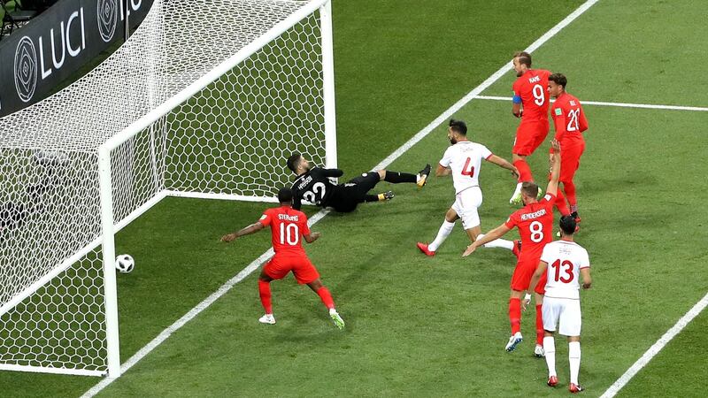 Harry Kane scores England’s opener against Tunisia. Photograph: Ryan Pierse/Getty