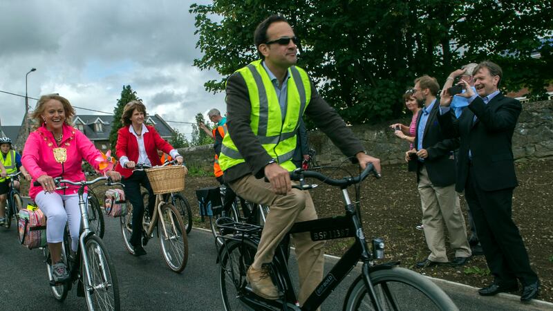 Leo Varadkar, then minister for transport in 2014, with former minister for social protection Joan Burton during the opening of the Galway-Dublin cross country greenway at the Twelfth Lock Royal Canal, Castleknock, Dublin. Photograph: Brenda Fitzsimons