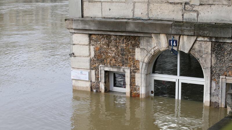 Café ‘Les Nautes’ in Paris partly immersed in the the water of the Seine river. Photograph: Geoffrey van der Hasselt/AFP/Getty Images