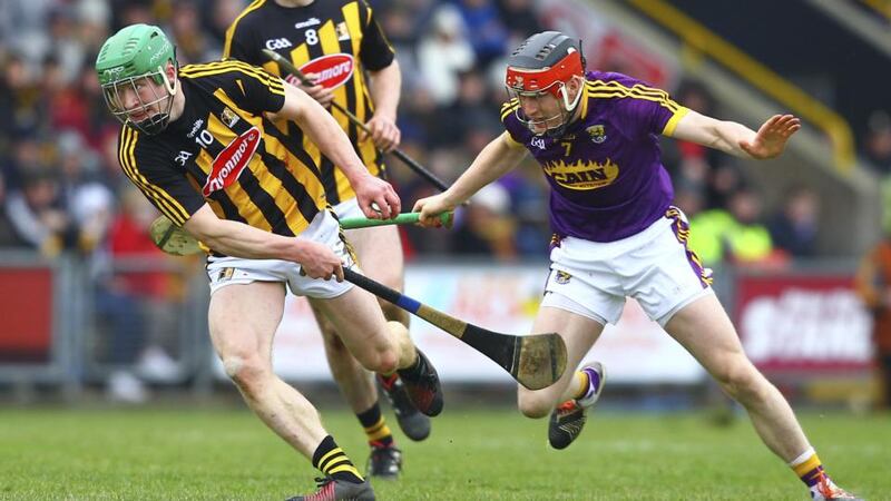 Kilkenny’s Martin Keoghan holds off Wexford’s  Diarmuid O’Keeffe. Photograph: Ken Sutton/Inpho