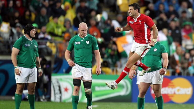Wales’ scrumhalf  Mike Phillips celebrates at the final whistle as a dejected Mike Ross, Paul O'Connell and Cian Healy of Ireland look on  following the 22-10 defeat in the 2011 quarter-final in Wellington. Photograph: Dan Sheridan/Inpho