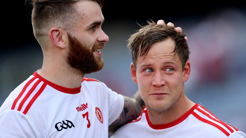 Tyrone’s Ronan McNamee with a tearful Kieran McGeary after their side’s win over Kerry. Photograph: James Crombie/Inpho