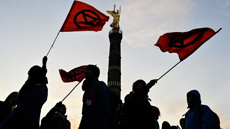 Protesters wave flags as they block the roads around the Victory Column  in Berlin. Photo: Tobias Schwarz/AFP via Getty
