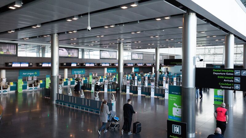 Aer Lingus  check-in desks at Terminal 2 in Dublin Airport. The airline told staff last week that it was cutting pay by 50 per cent. Photograph: Tom Honan