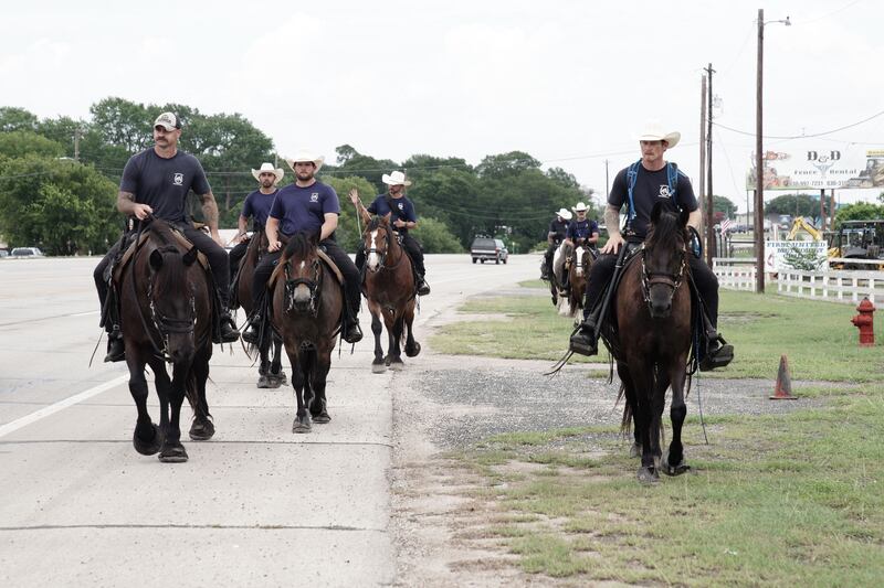 Austin police officers take part in  a search-and-rescue operation near the Guadalupe River in Ingram, Texas. Photograph: EPA