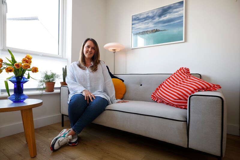 Chelsey Killen on the sofa she bought in a thrift shop. Photograph Nick Bradshaw 