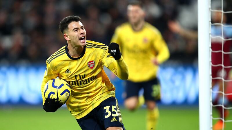 Gabriel Martinelli celebrates after scoring Arsenal’s equaliser against West Ham. Photograph: Julian Finney/Getty