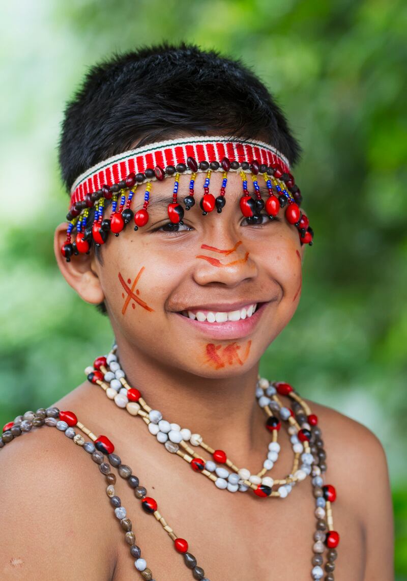 Shuar boy wearing traditional dress in Limón,  Guayas, Ecuador. Photograph: Insights/Universal Images Group via Getty Images