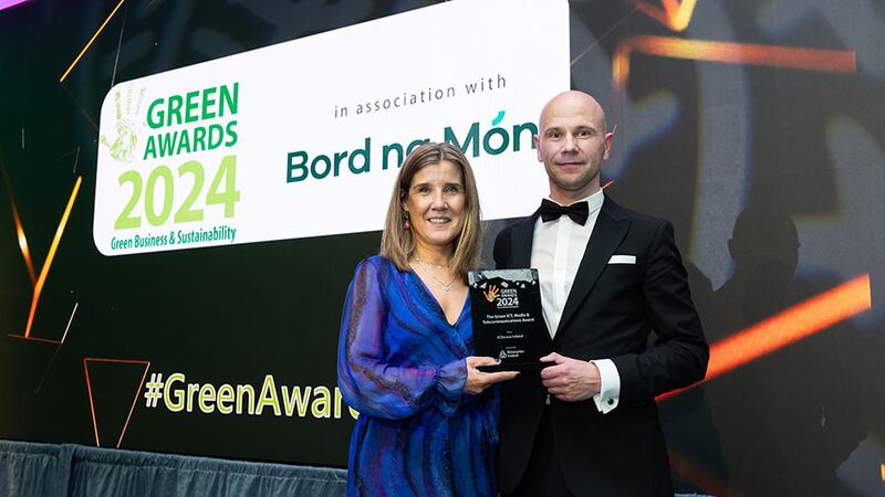 Kathleen O'Regan, senior executive, sustainability Department of Enterprise Ireland, presents the green ICT, media & telecommunications award to Deividas Januska, JCDecaux Ireland