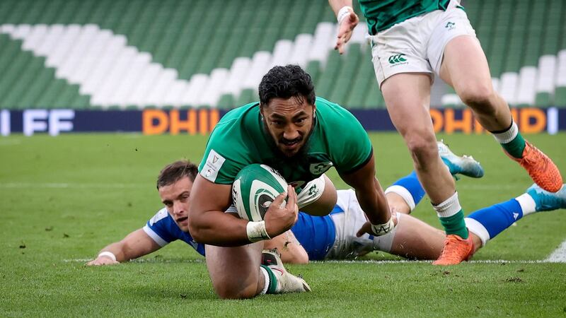 Bundee Aki dives to score for Ireland against Italy. Photograph: Billy Stickland/Inpho