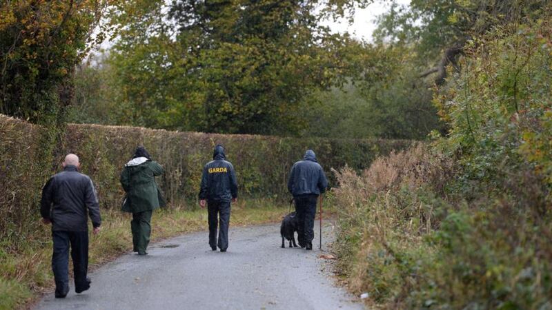 Gardaí search a field early today around the area where a severed arm was found near Mayne, Clonee, Co Meath, yesterday. Photograph: Dara Mac Dónaill/The Irish Times