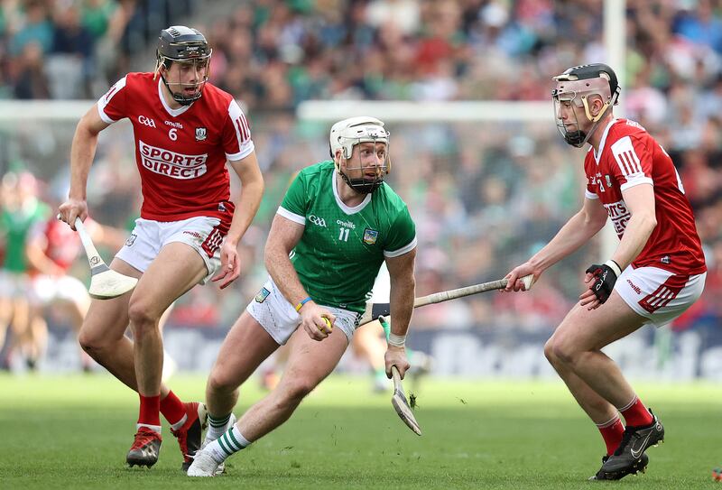 Cork's Robert Downey and Cian Lynch of Limerick during the GAA All-Ireland Senior Hurling Championship Semi-Final, at Croke Park, Dublin. Photograph: ©INPHO/Bryan Keane