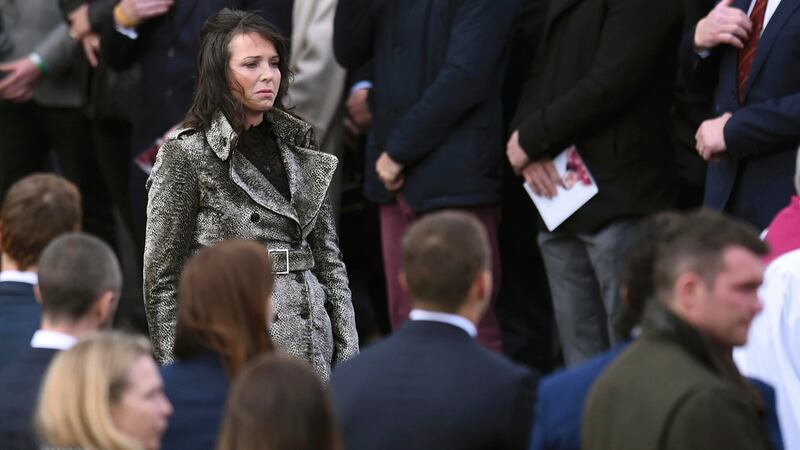 A sister of Anthony Foley leaves after his funeral service at St Flannan’s Church in Killaloe, Ireland. Photograph: Clodagh Kilcoyne/Reuters