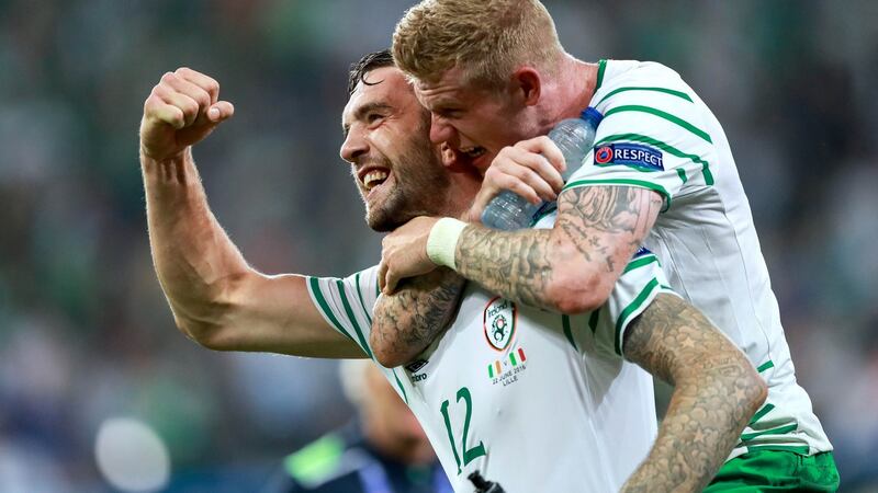 Shane Duffy and James McClean celebrate after Ireland’s 1-0 win over Italy in Lille. Photograph: Inpho/James Crombie