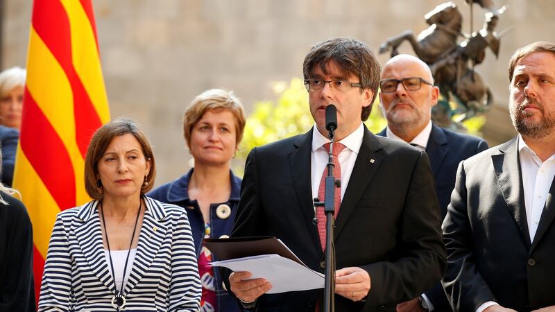 Catalonia’s President Carles Puigdemont announces the referendum at the Palau de la Generalitat, Barcelona. Photograph: Albert Gea/Reuters