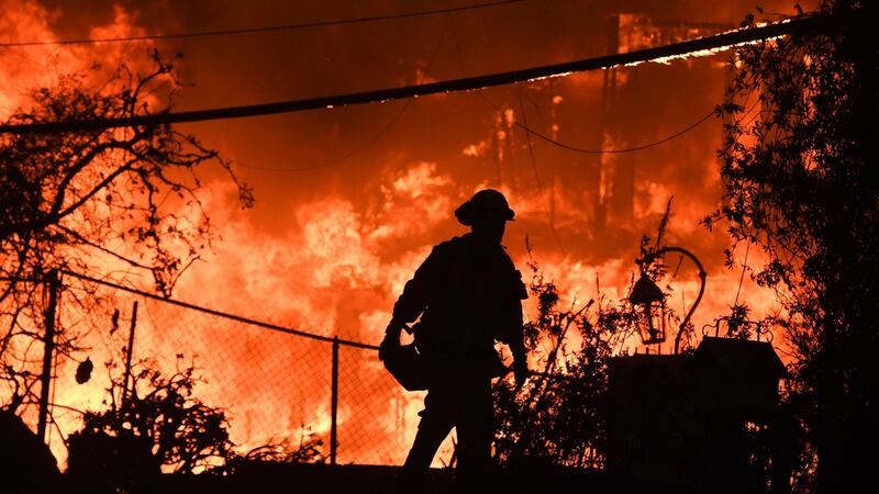 A firefighter on the Pacific Coast Highway near Malibu on November 9th, 2018. About 75,000 homes were evacuated in Los Angeles and Ventura counties. Photograph: Robyn Beck/AFP/Getty Images