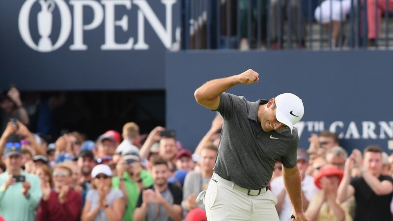 Francesco Molinari of Italy celebrates a birdie on the 18th hole during the final round of the 147th Open Championship at Carnoustie. Photograph: Harry How/Getty Images