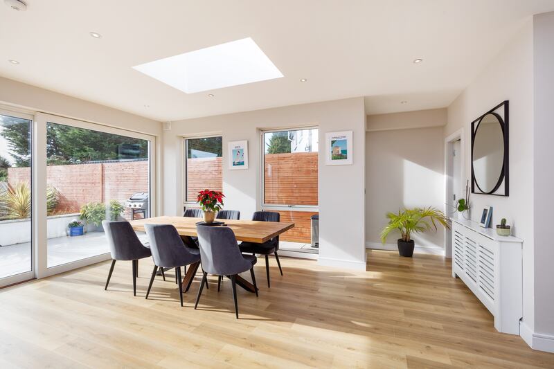 The room is bathed in light thanks to lots of glazing