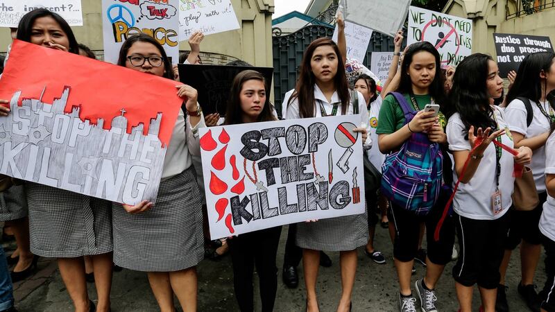 Philippine students hold placards during a  protest against drug related killings in Manila on  September 30th. Photograph: Mark R Cristino/EPA