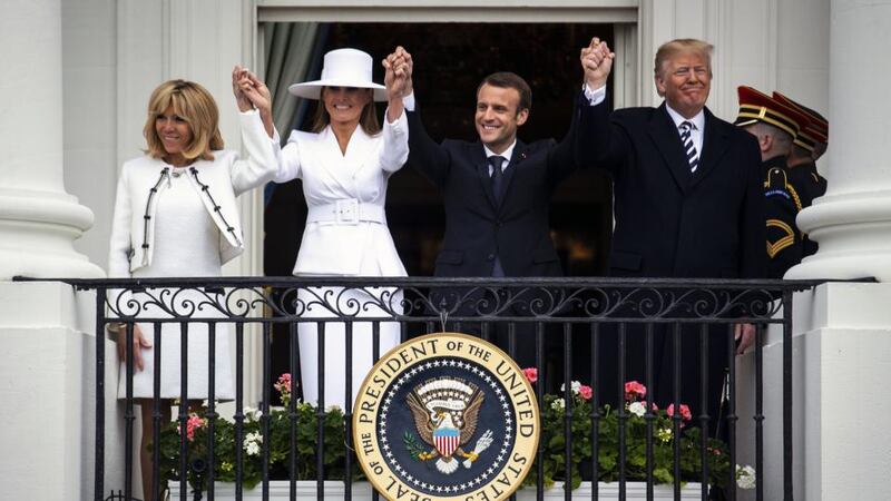 White House wave: Brigitte Macron, Melania Trump, Emmanuel Macron and Donald Trump on the White House balcony. Photograph: Al Drago/Bloomberg