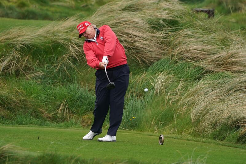 Donald Trump drives a ball from a tee in Doonbeg on Thursday. Photograph: Brian Lawless/PA Wire 