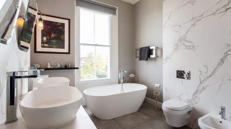 Owner of 43 Palmerston Road converted one of the bedrooms into the family bathroom with a free-standing contemporary bath and matching his-and-her sinks,
