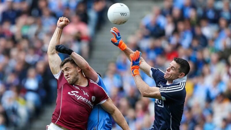 Galway’s Damien Comer scores a goal under pressure from Stephen Cluxton of Dublin. Photograph: Tommy Dickson/Inpho