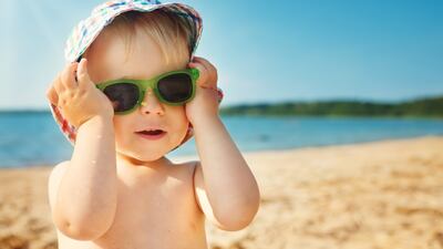 Babies should be covered up because their skin does not properly absorb sun cream.
